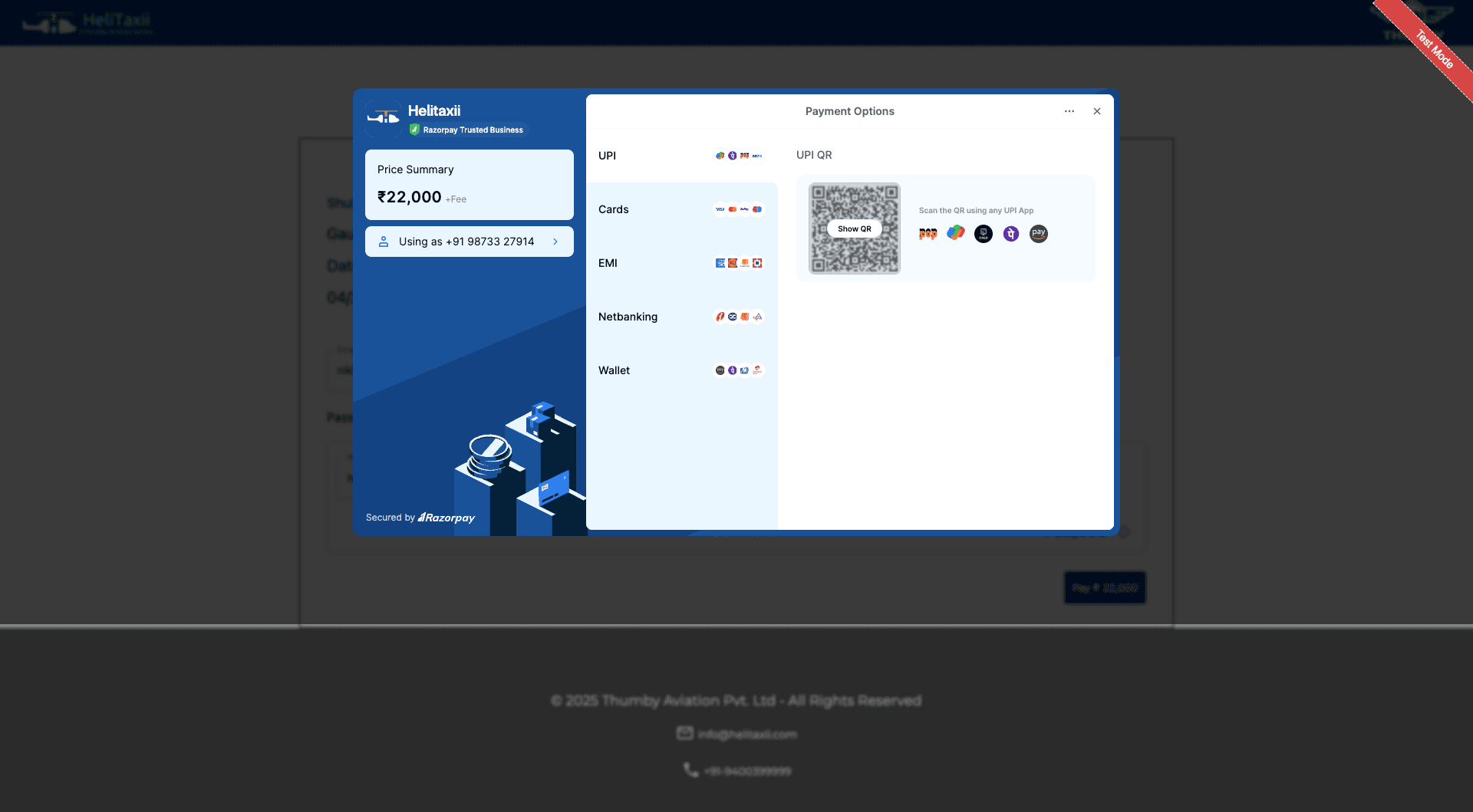 Helitaxii booking — Razorpay modal showing UPI QR, Cards, EMI, Netbanking and Wallet options